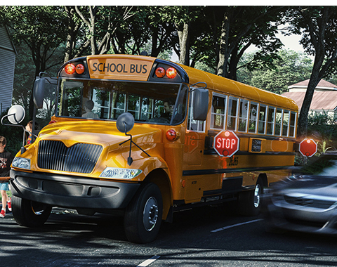 Aerial image of a car passing a bus